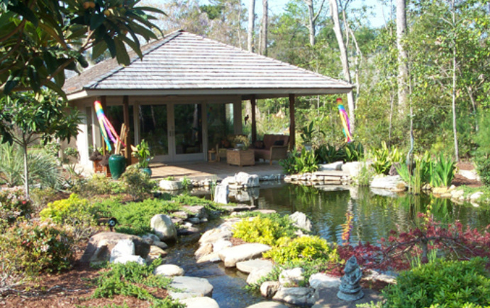 North Carolina Home Garden The Bali house is surrounded by a walled garden on 3/4 of an acre in a landscape of jungle and tropical gardens, Southeast Asian statuary, a koi pond and ...